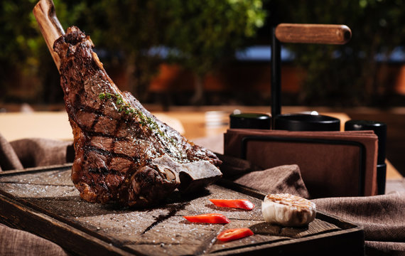 Big Meat Steak And Vegetables Lying On A Table