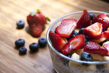 cereal in glass bowl with fruit and berries