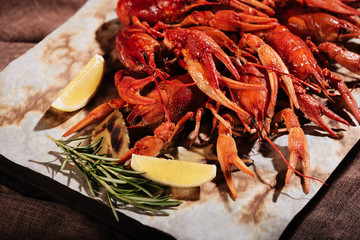 Crayfishes with lemon and rosemary lying on a pita