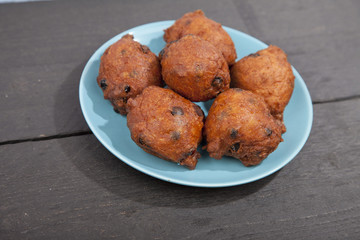 Traditional Dutch oliebollen on wooden background