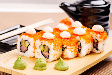 Maki Sushi made of Salmon, Red caviar, cucumber, avocado