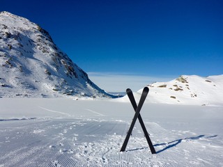 SKI EQUIPMENT FRONT OF THE ICE COLD LAKE, , DOMAIN OF 4 VALLEYS , VERBIER , VALAIS , SWISS

