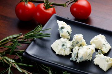 Blue cheese with cherry tomatoes,rosemary and thyme