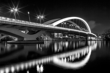 Illuminated bridge Raymond Barre over the Rhone river in Lyon at night.