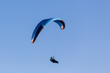 one paragliding in the sky