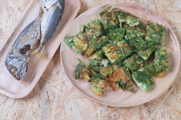 Fried acacia pennata omelet with fried mackerel