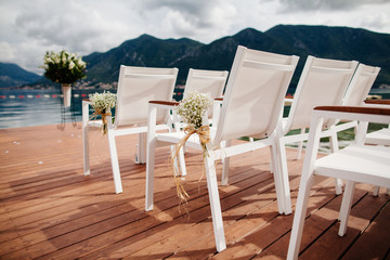 wedding chairs with flowers decoration
