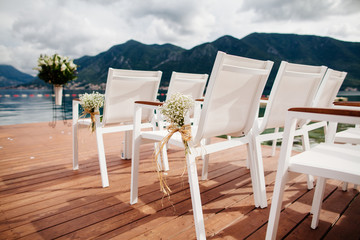 wedding chairs with flowers decoration