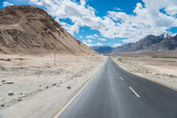 Aerial view of Le-h City, landscape with ice peaks , blue sky in background , Ladak-h, Jam-mu and Kashmir, India