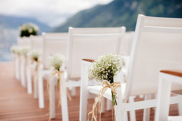 wedding chairs with flowers decoration