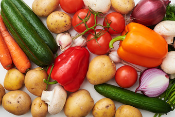 Close-up of different organic vegetables lying on flat layout