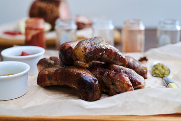 Close-up of grilled sausages served on a cutting board