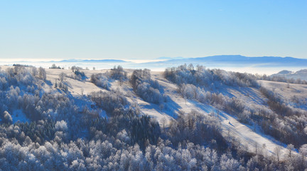 Fototapeta na wymiar Mountain covered in snow and frost, beautiful winter landscape 