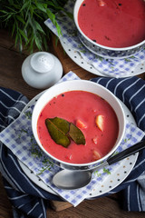 Vegetarian red soup - borsch in green bowl.