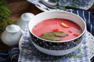 Vegetarian red soup - borsch in green bowl.