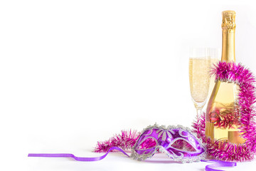 Masquerade mask and champagne on a white background.