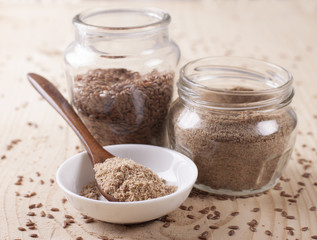 Flax flour in a wooden spoon