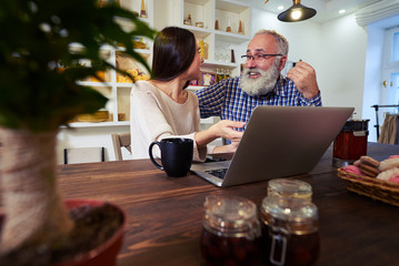 Pleasant conversation of mature man and young female talking whi