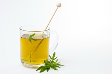 Cannabis herbal tea and marijuana leaves