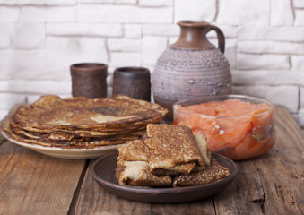  Pancakes of rye flour with salted salmon.