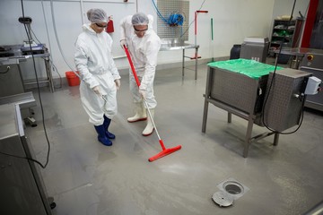 Staff cleaning the floor