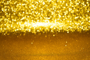 Defocused abstract golden glitter with bokeh background