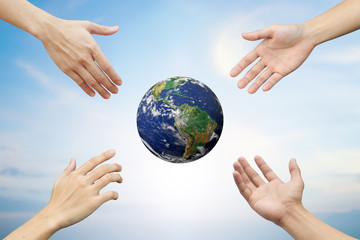 Supporting and assistance of Four hands reaching together the circle world for heal together, save/safe the globe concept:people global communication network:Elements of this image furnished by NASA