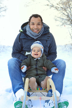 Father And Baby On A Sled - Family Having Fun In Winter