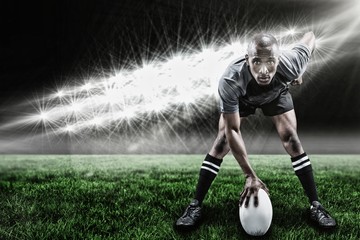 Naklejka premium Composite image of portrait of sportsman playing rugby and 3d 