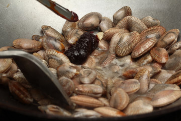 Cooking , Stir fried clams with roasted chile paste.