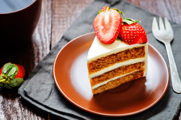 Carrot cake decorated with strawberries
