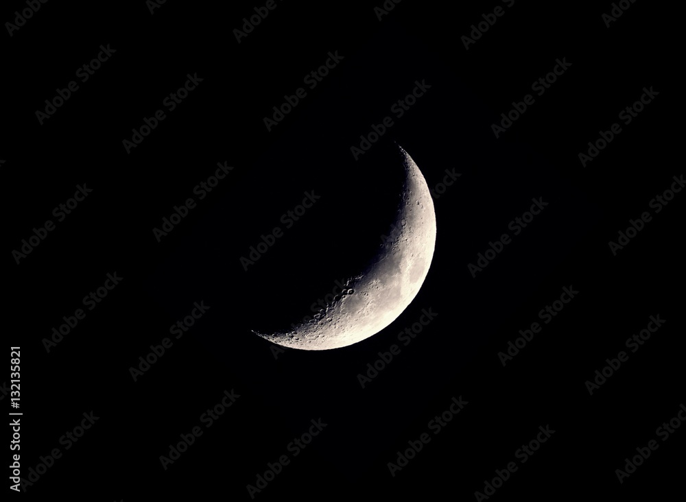 Wall mural beautiful mystical half moon on dark night sky background with copy space