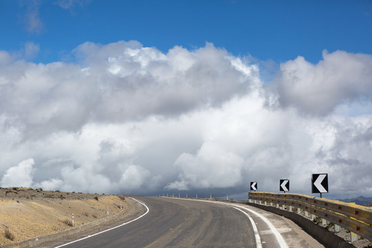 road leading towards the clody sky