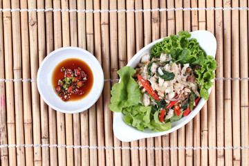 Stir - fried spicy basil with crab and spicy sauce.