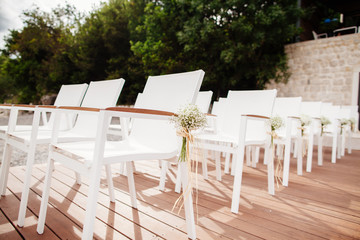wedding chairs with flowers decoration