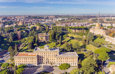 Fototapeta na wymiar View at the Vatican Gardens and the Palace of the Governorate in Rome from the dome of St. Peter's basilica.
