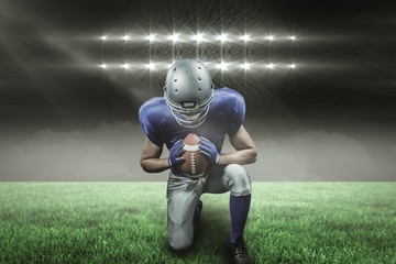 Composite image of american football player kneeling with 3d 