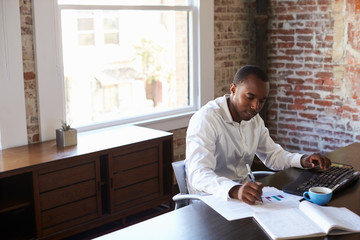 Businessman Working On Computer In Office