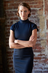 Obraz premium Head And Shoulders Portrait Of Young Businesswoman In Office