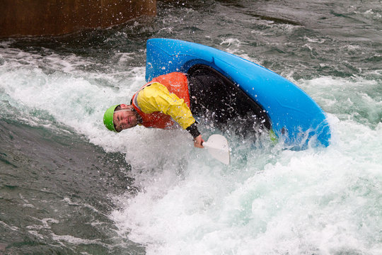Man in kayak about to capsize