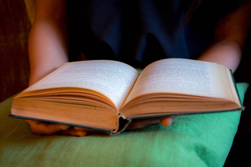 Reading a book and a book in girl's hands