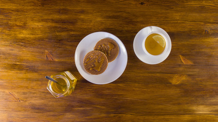 Sweet breakfast in cafe, top view on wooden table