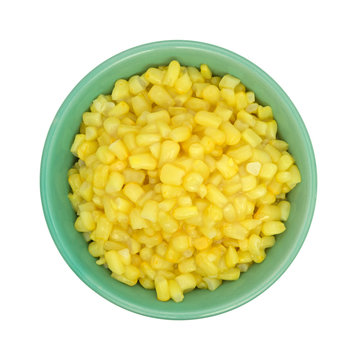 Shoepeg white corn with a butter sauce in a bowl.