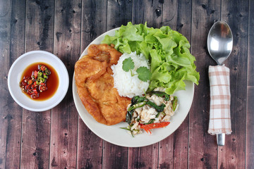 Rice topped stir - fried spicy basil with crab and minced-pork o