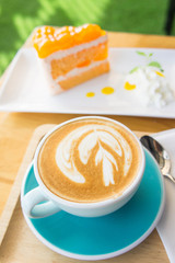 Delicious cup of coffee aromatic and delicious cakes.