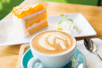 Delicious cup of coffee aromatic and delicious cakes.