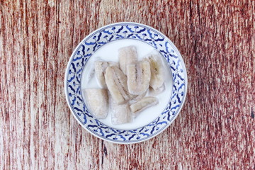 Ready served cultivated banana in coconut milk .