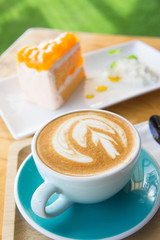 Delicious cup of coffee aromatic and delicious cakes.