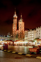 Fair in KRAKOW. Main Market Square and St. Mary's Basilica - 132144287