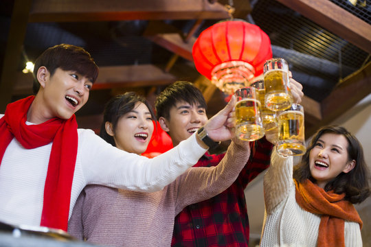 Young friends toasting for Chinese new year